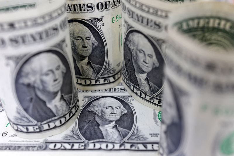 Dollar hugs 13-month peak as market awaits next Fed cue