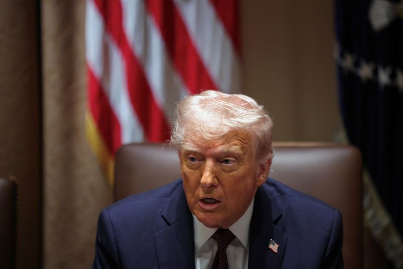 Fight or cut a deal? Law firms face stark choice under Trump