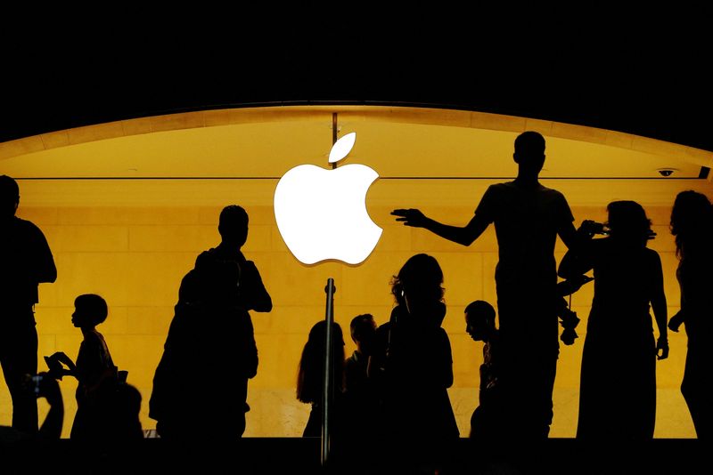 Apple girds for more trade war pain, trims buyback